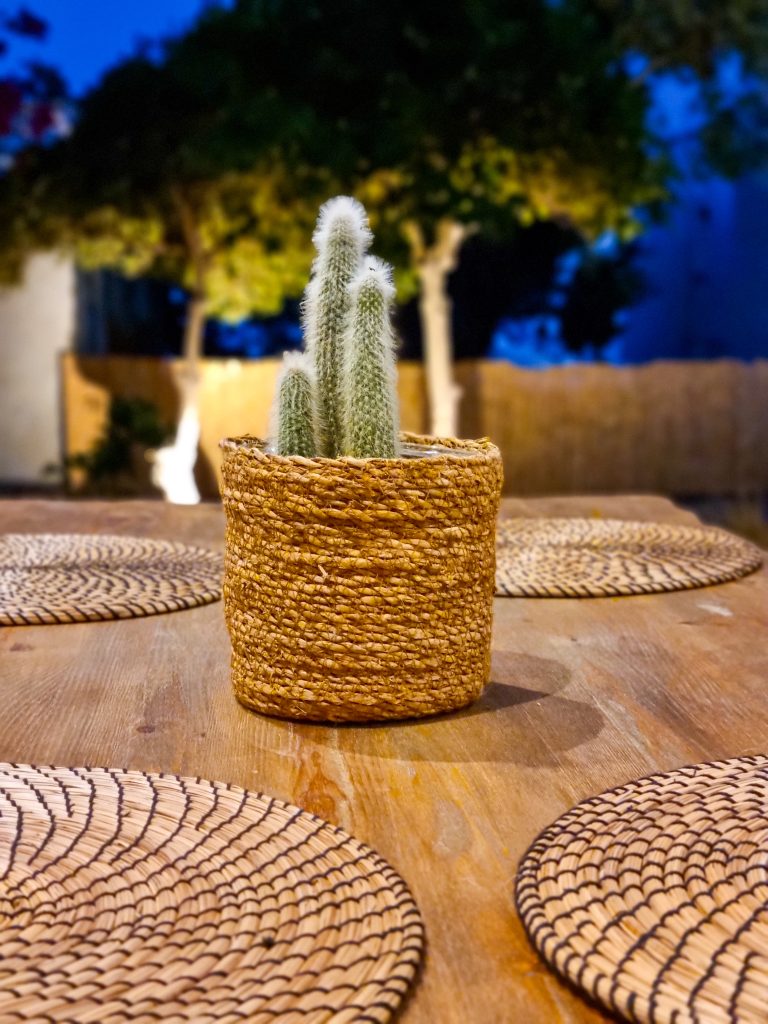 Exterior dining table with comfortable seating and light seaera luxury apartment Tinos