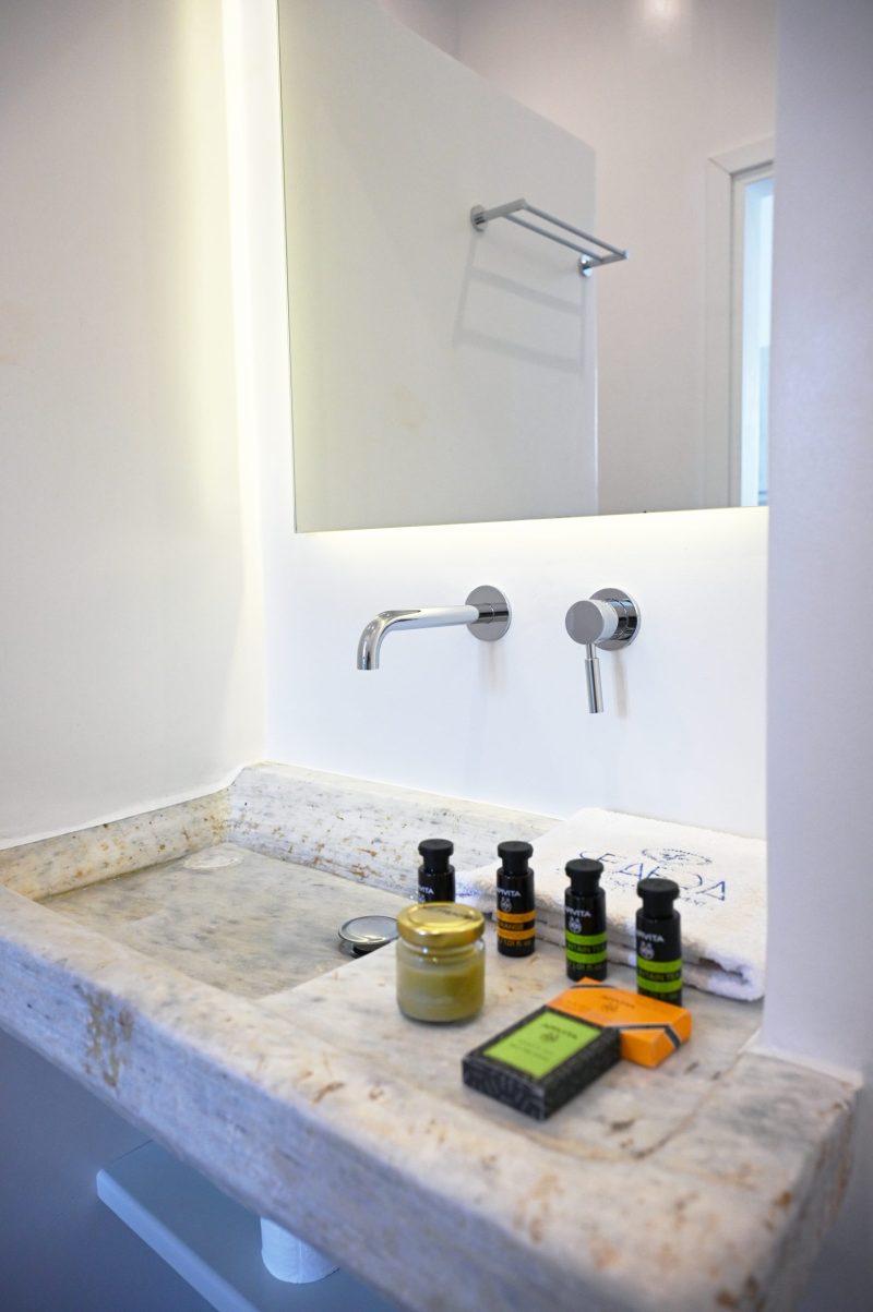 Modern bathroom with walk-in shower and sleek fixtures seaera luxury Tinos apatment.