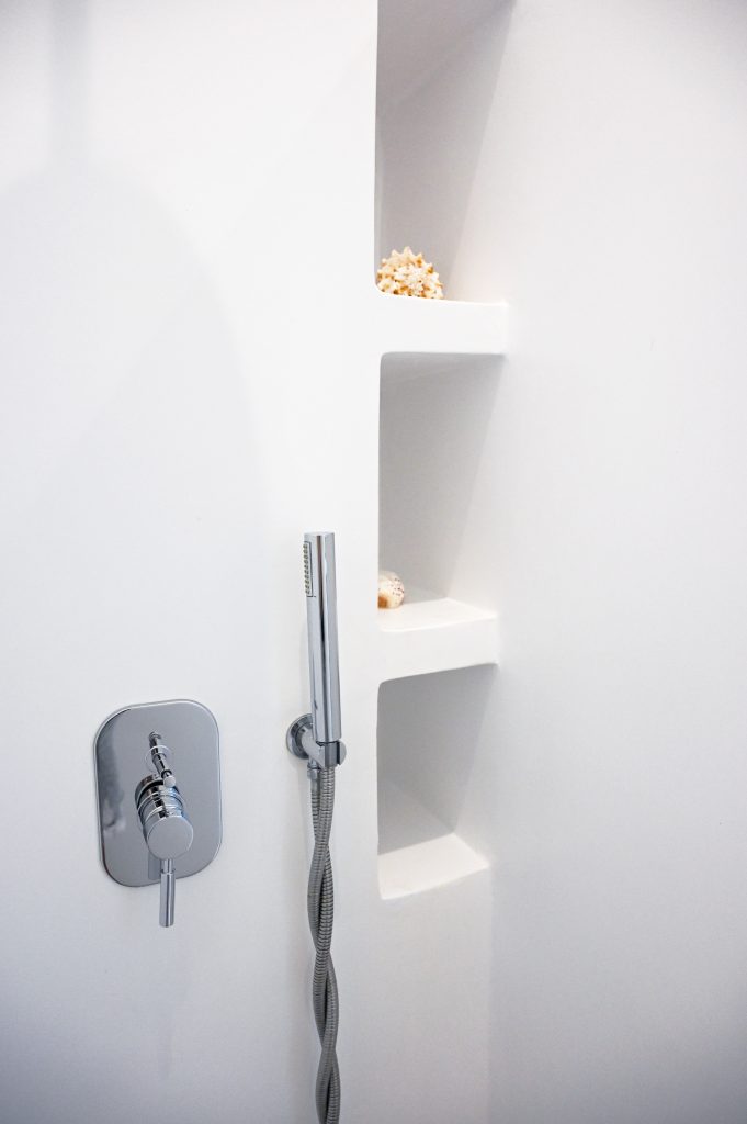 Modern bathroom with walk-in shower and sleek fixtures seaera luxury Tinow apartment